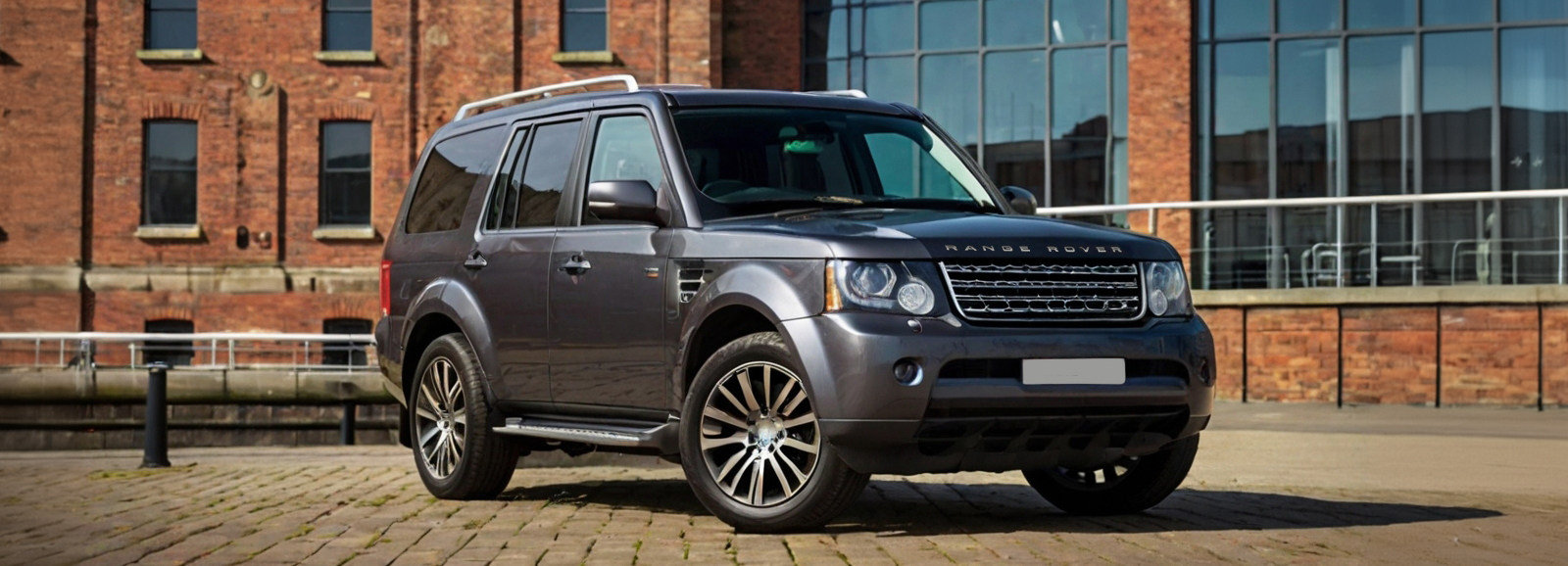 A Land Rover parked in front of a building